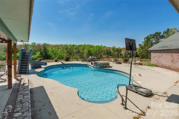 a view of a swimming pool with a patio