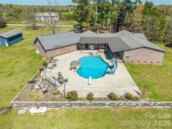 an aerial view of a house with a ocean view