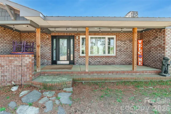a view of a brick house with many windows