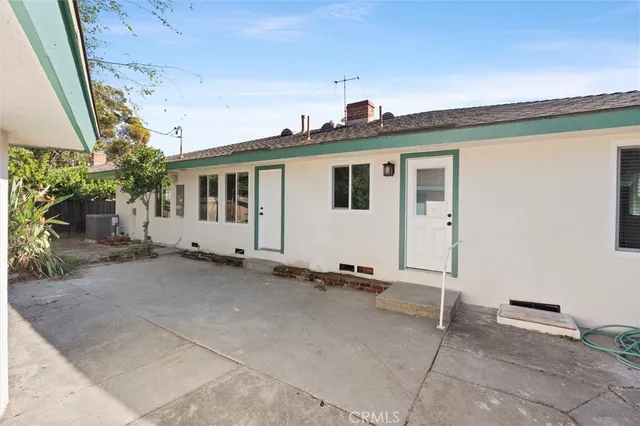 a house view with a backyard space