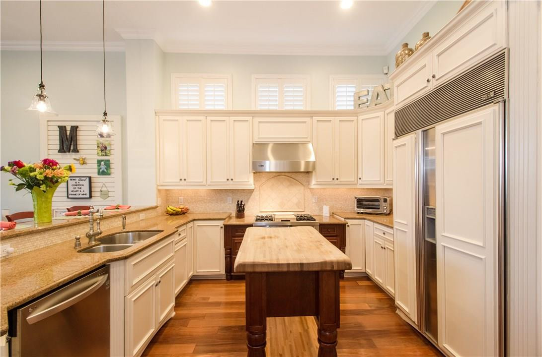13841 Southwest 44th Street Davie, FL 33330 - Photo 12 of 40 a kitchen with a sink stove and refrigerator