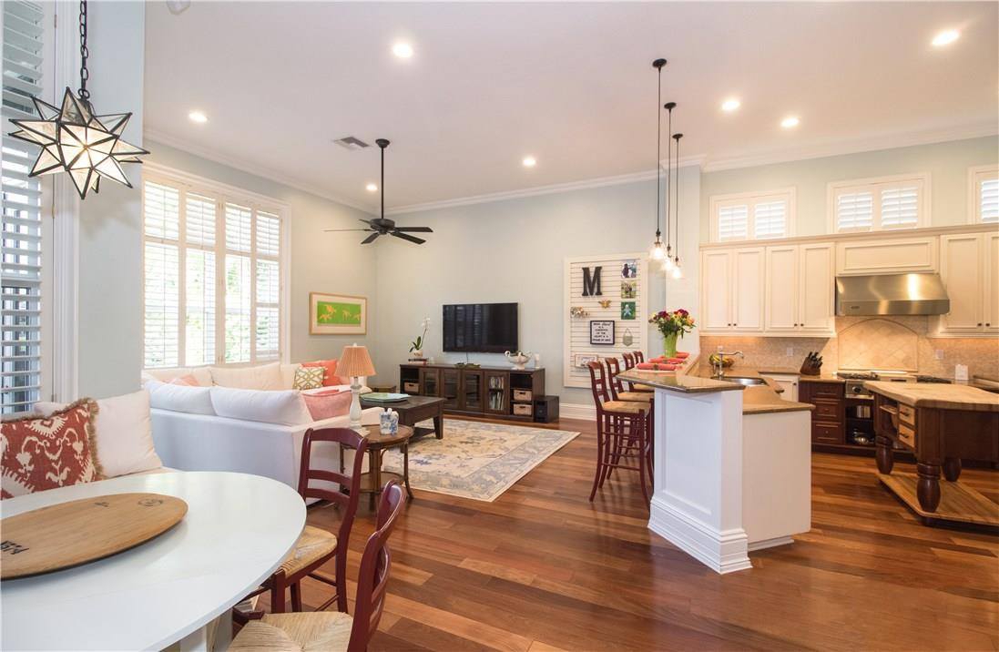 13841 Southwest 44th Street Davie, FL 33330 - Photo 16 of 40 a living room with furniture kitchen view and a wooden floor