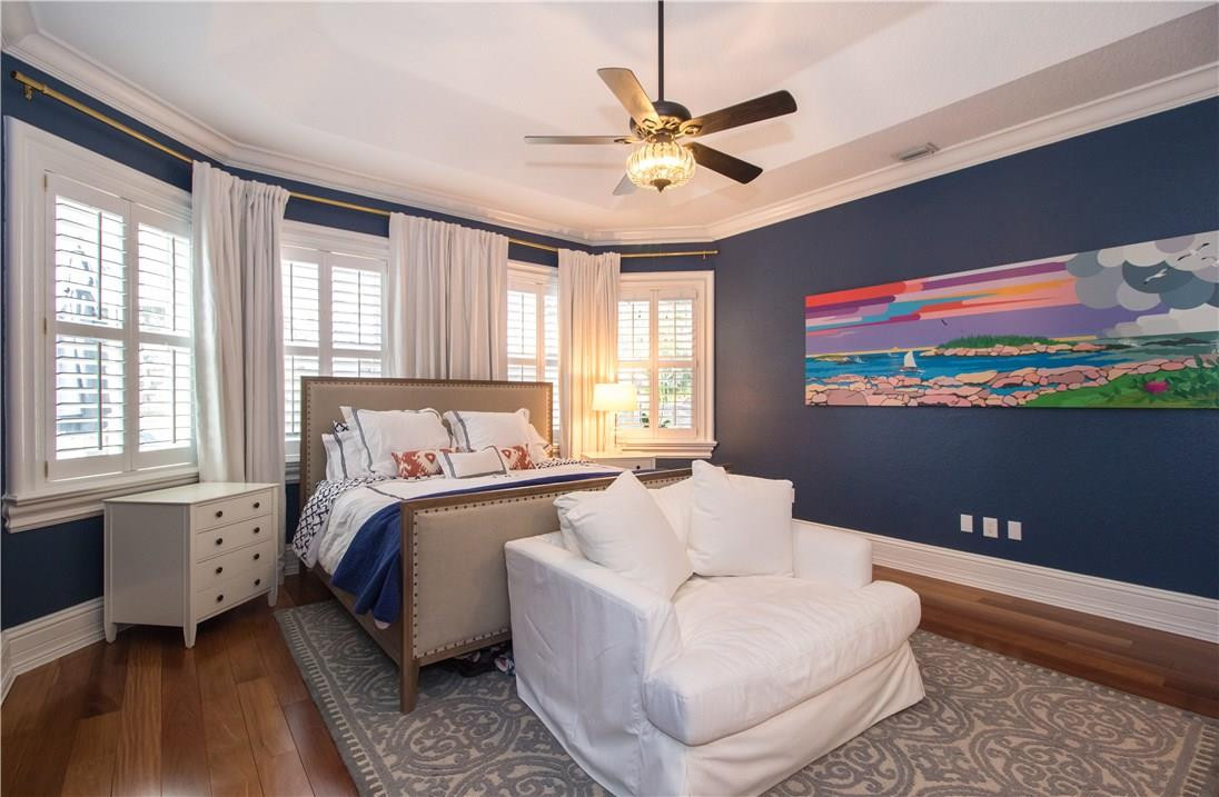 13841 Southwest 44th Street Davie, FL 33330 - Photo 18 of 40 a spacious bedroom with a bed and a chandelier