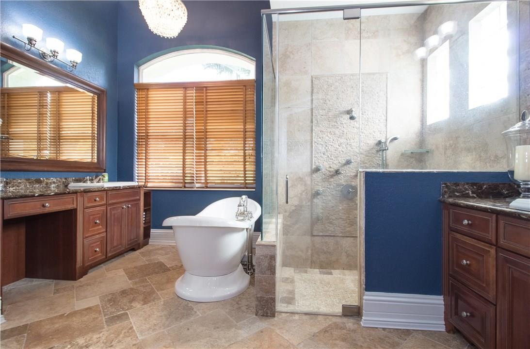 13841 Southwest 44th Street Davie, FL 33330 - Photo 19 of 40 a bathroom with a granite countertop sink toilet and shower