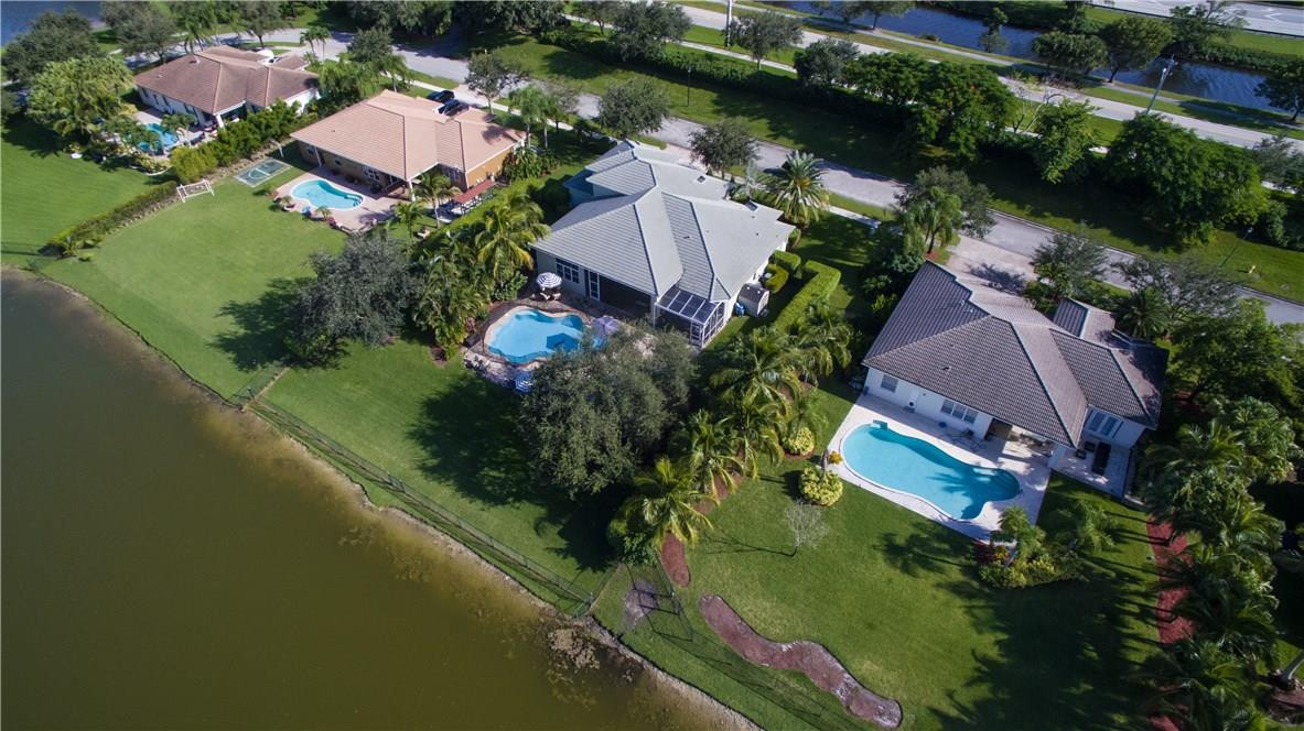 13841 Southwest 44th Street Davie, FL 33330 - Photo 2 of 40 an aerial view of residential houses with outdoor space and lake view