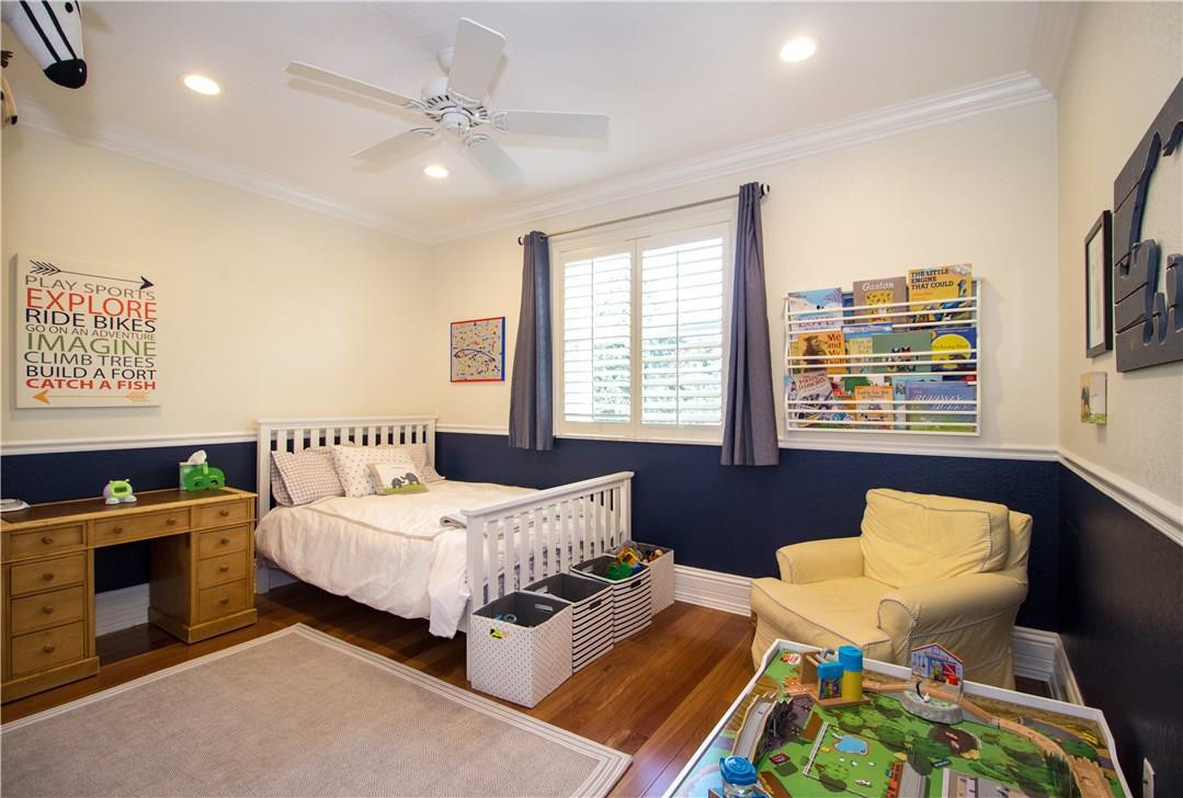 13841 Southwest 44th Street Davie, FL 33330 - Photo 23 of 40 a bedroom with a bed window and a chair
