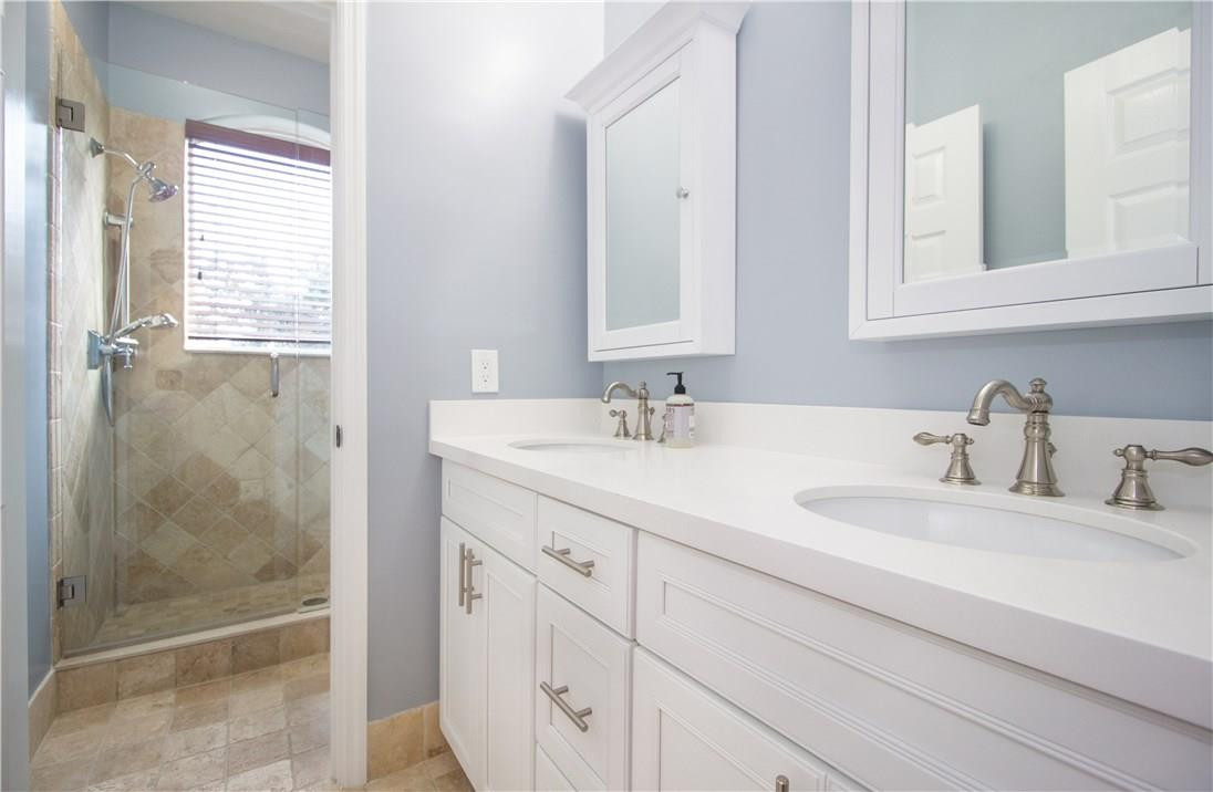 13841 Southwest 44th Street Davie, FL 33330 - Photo 25 of 40 a bathroom with double sink and a mirror