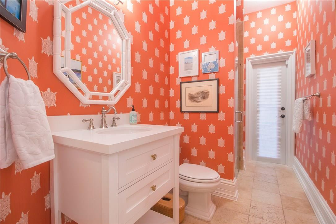 13841 Southwest 44th Street Davie, FL 33330 - Photo 27 of 40 a bathroom with a sink a toilet and shower curtain
