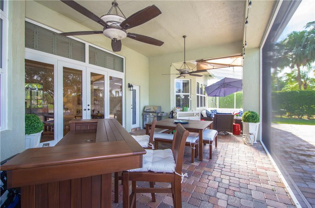 13841 Southwest 44th Street Davie, FL 33330 - Photo 29 of 40 a outdoor space with lots of tables a large window and chairs
