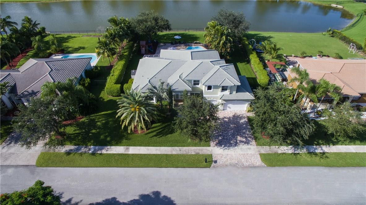 13841 Southwest 44th Street Davie, FL 33330 - Photo 36 of 40 a view of a garden with a fountain