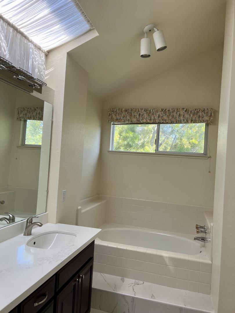 11792 Pine Brook Lane Cupertino, CA 95014 - Photo 13 of 19 a bathroom with a bathtub and a sink