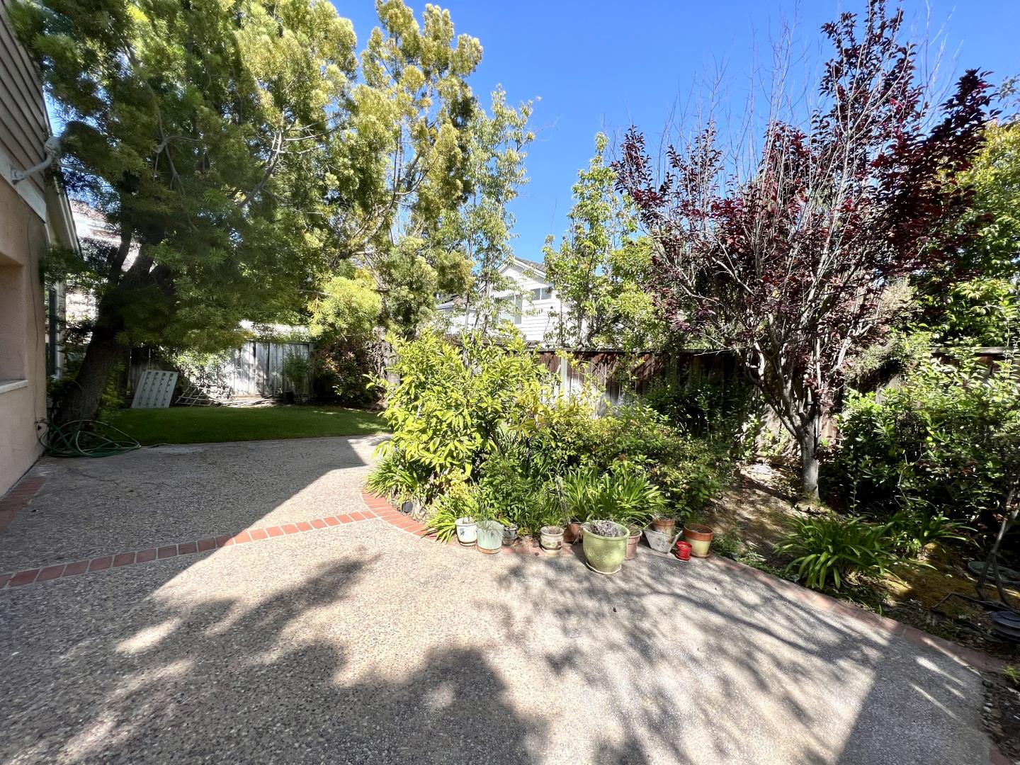 11792 Pine Brook Lane Cupertino, CA 95014 - Photo 14 of 19 a view of a yard with plants and trees