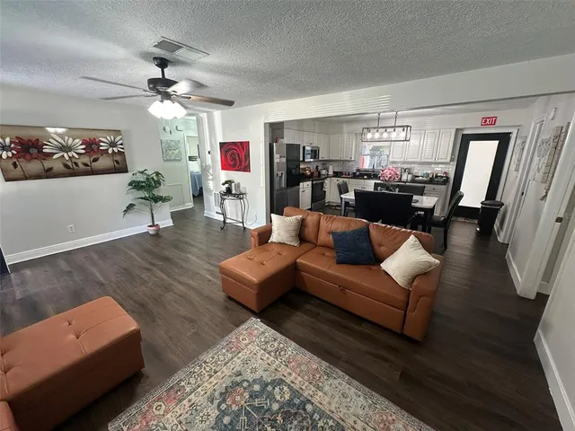 a kitchen with a sink stove and microwave