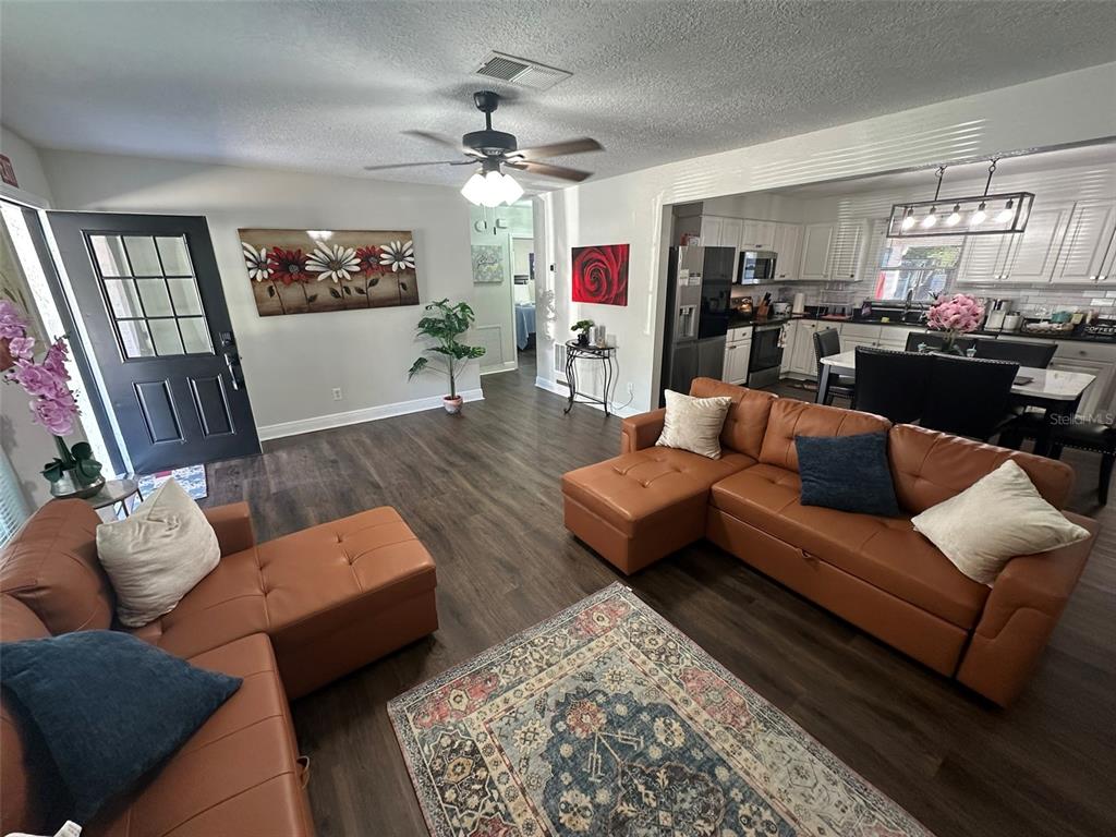 16903 Hanna Road Lutz, FL 33549 - Photo 13 of 94 a living room with furniture fireplace and a window