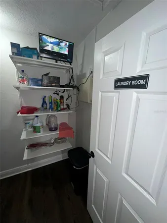 a kitchen with granite countertop kitchen island stainless steel appliances a sink window and cabinets