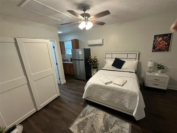 a bathroom with a double vanity sink toilet and shower
