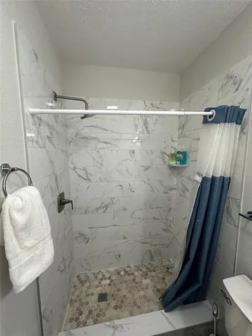 a en suite bathroom with a sink and a mirror