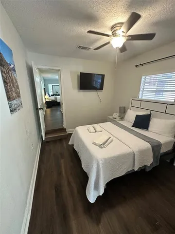 a view of an entryway of a house and wooden floor