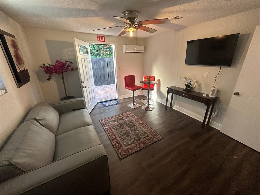16903 Hanna Road Lutz, FL 33549 - Photo 35 of 94 a living room with furniture and a flat screen tv