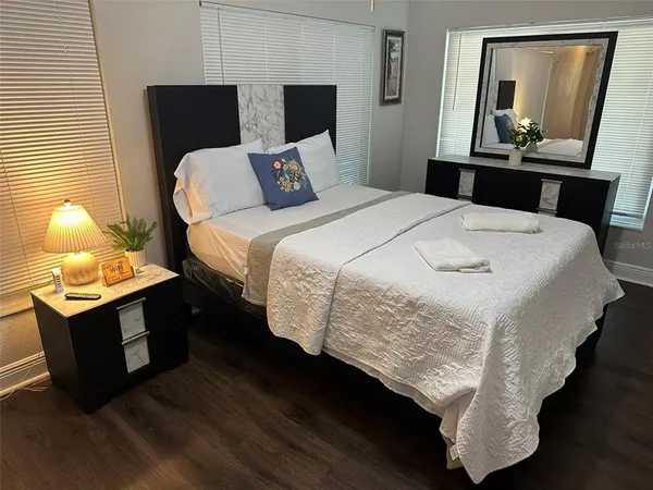 a house view with a sitting space and garden