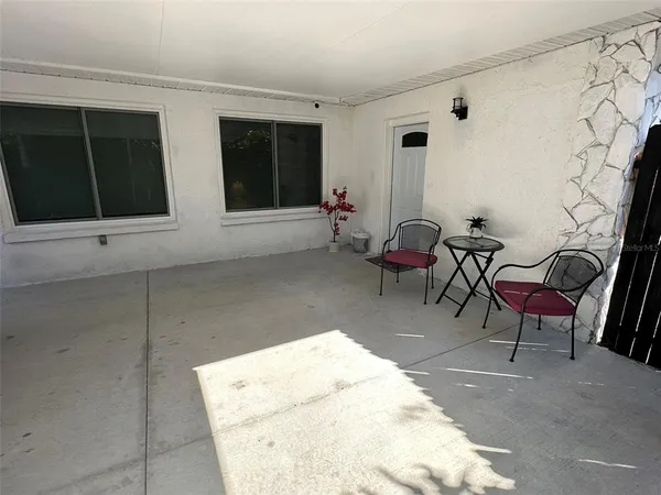 a view of a backyard of the house