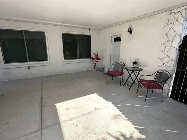 a view of a backyard of the house