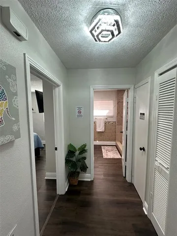 a living room with furniture flowers and a chandelier