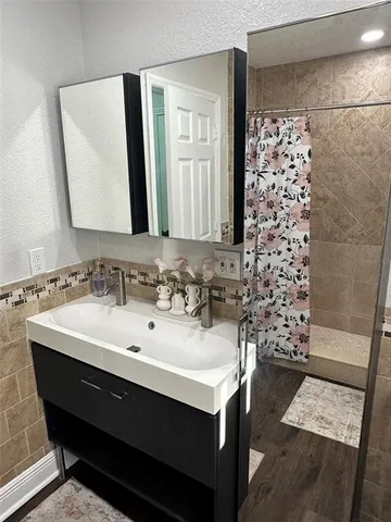 a living room with furniture and a large mirror