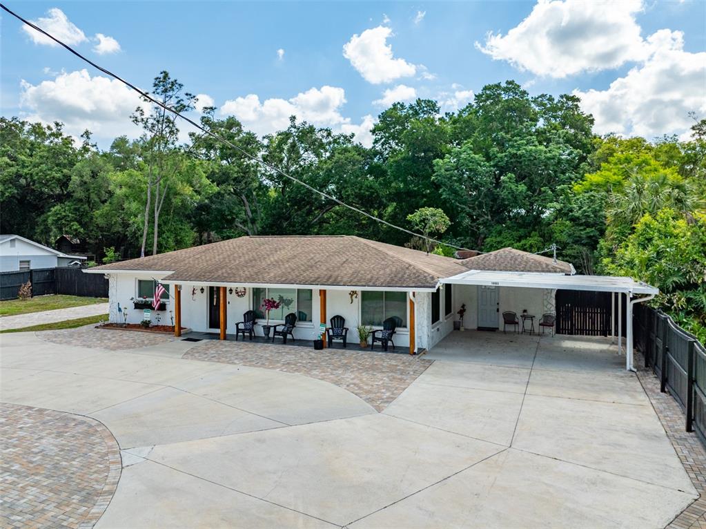 16903 Hanna Road Lutz, FL 33549 - Photo 5 of 94 a view of a house with a yard and sitting area