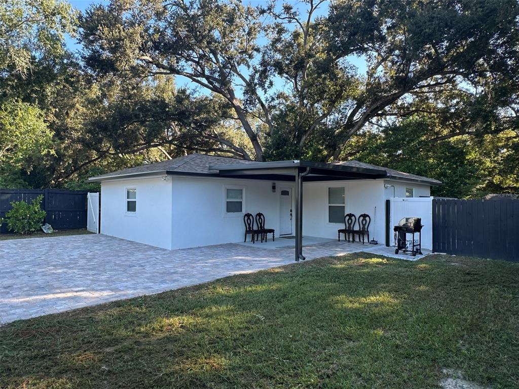 16903 Hanna Road Lutz, FL 33549 - Photo 61 of 94 a house view with a sitting space and garden