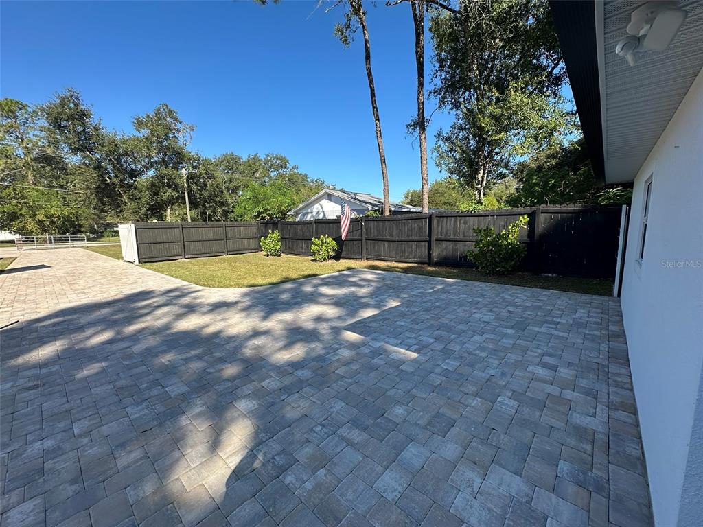 16903 Hanna Road Lutz, FL 33549 - Photo 64 of 94 a view of a backyard