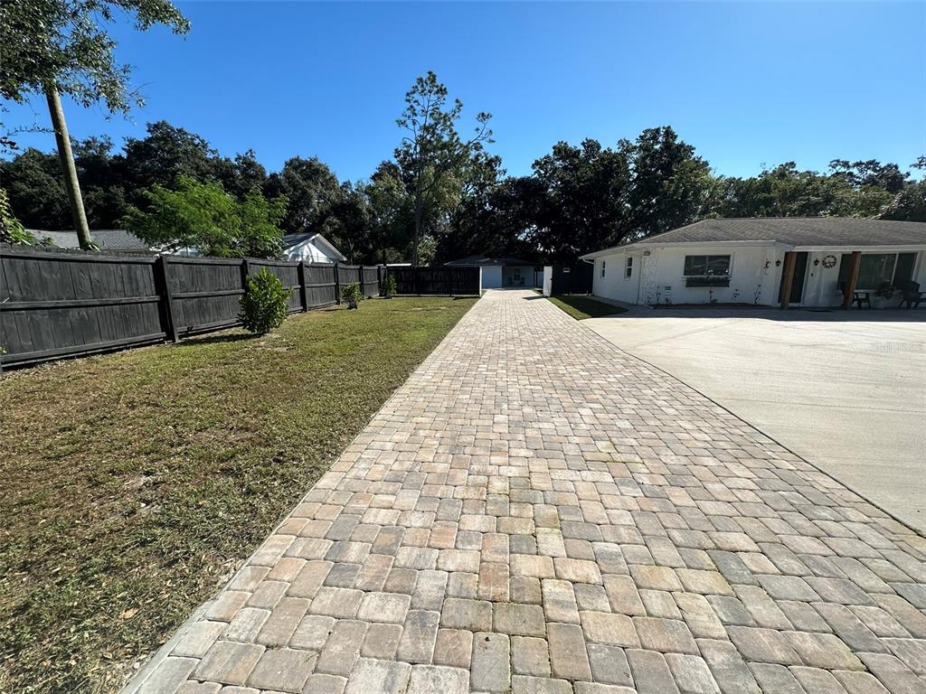 16903 Hanna Road Lutz, FL 33549 - Photo 9 of 94 a front view of a house with a yard
