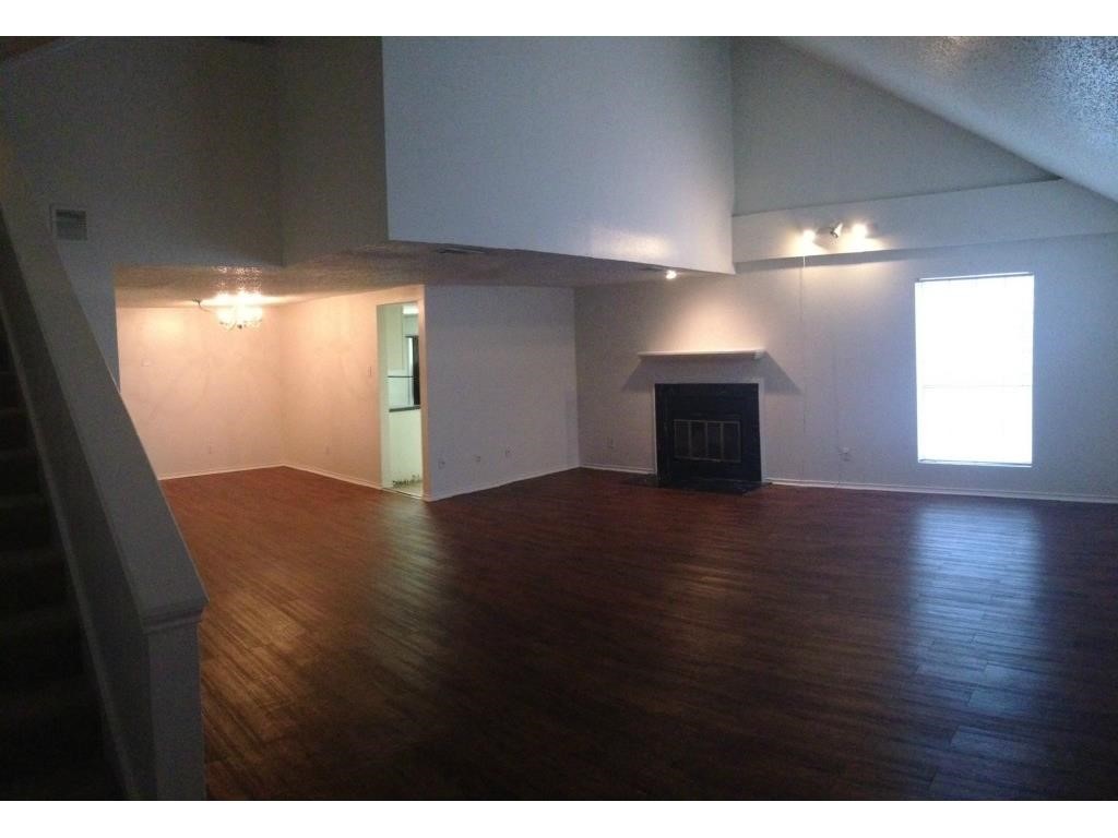 2401 Leon Street, Unit 305 Austin, TX 78705 - Photo 1 of 13 a view of a livingroom with wooden floor