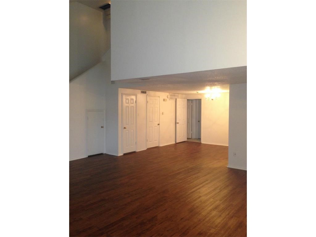 2401 Leon Street, Unit 305 Austin, TX 78705 - Photo 3 of 13 a view of an empty room with wooden floor