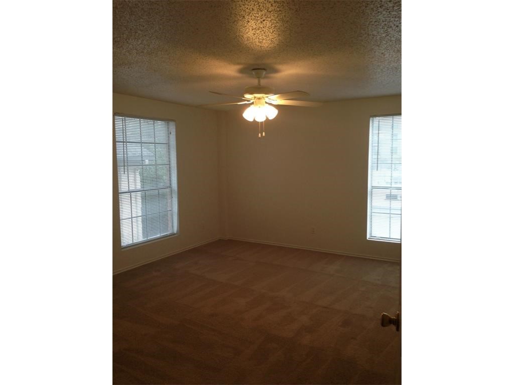 2401 Leon Street, Unit 305 Austin, TX 78705 - Photo 7 of 13 a view of an empty room with windows