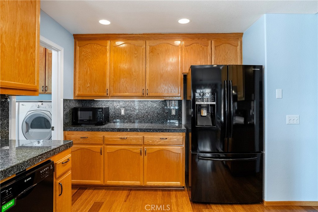 9340 Mountain View Drive Atascadero, CA 93422 - Photo 13 of 50 a kitchen with stainless steel appliances granite countertop a refrigerator and a sink