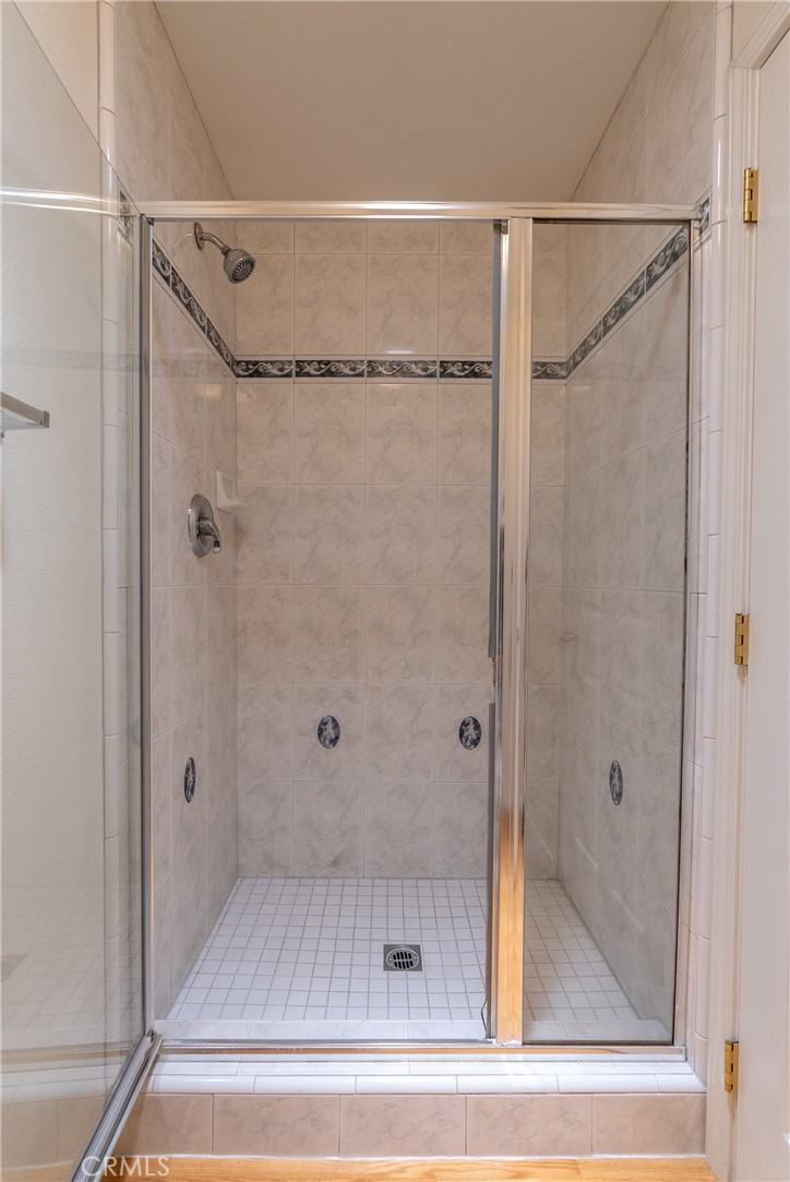 9340 Mountain View Drive Atascadero, CA 93422 - Photo 25 of 50 a bathroom with a glass shower door