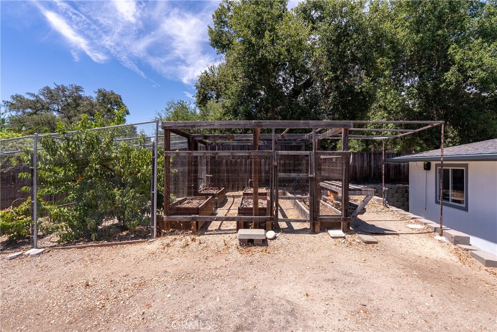 9340 Mountain View Drive Atascadero, CA 93422 - Photo 42 of 50 a view of backyard with tv and outdoor seating