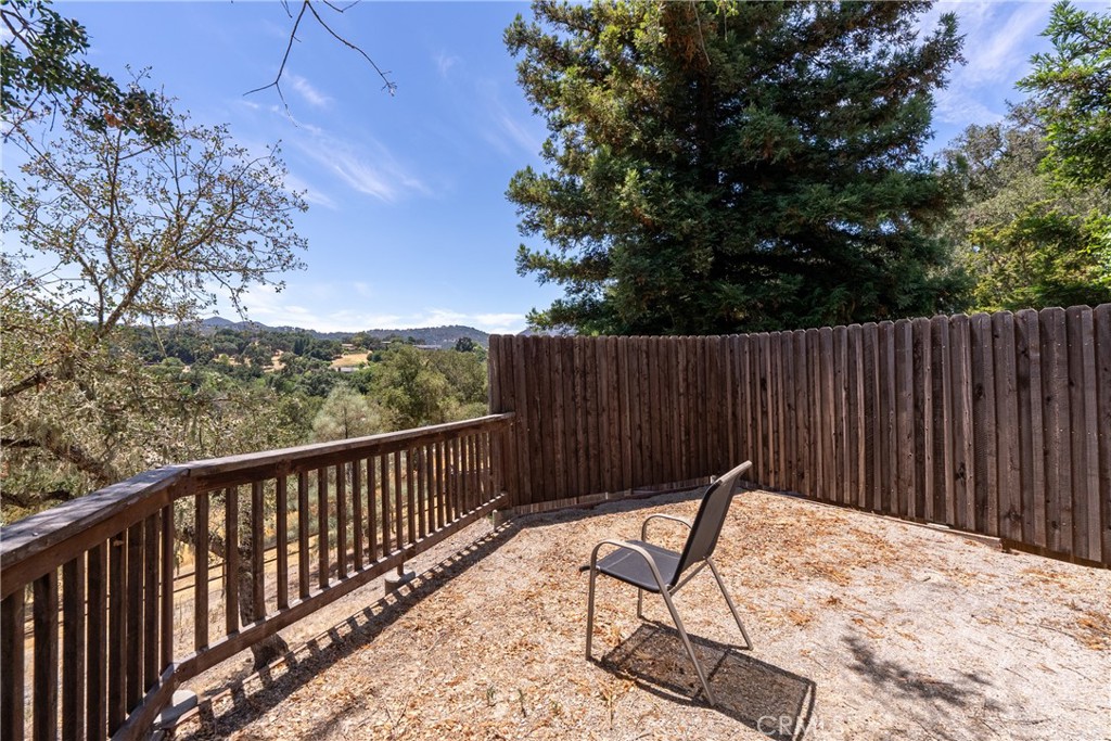 9340 Mountain View Drive Atascadero, CA 93422 - Photo 46 of 50 a view of backyard with wooden fence and trees