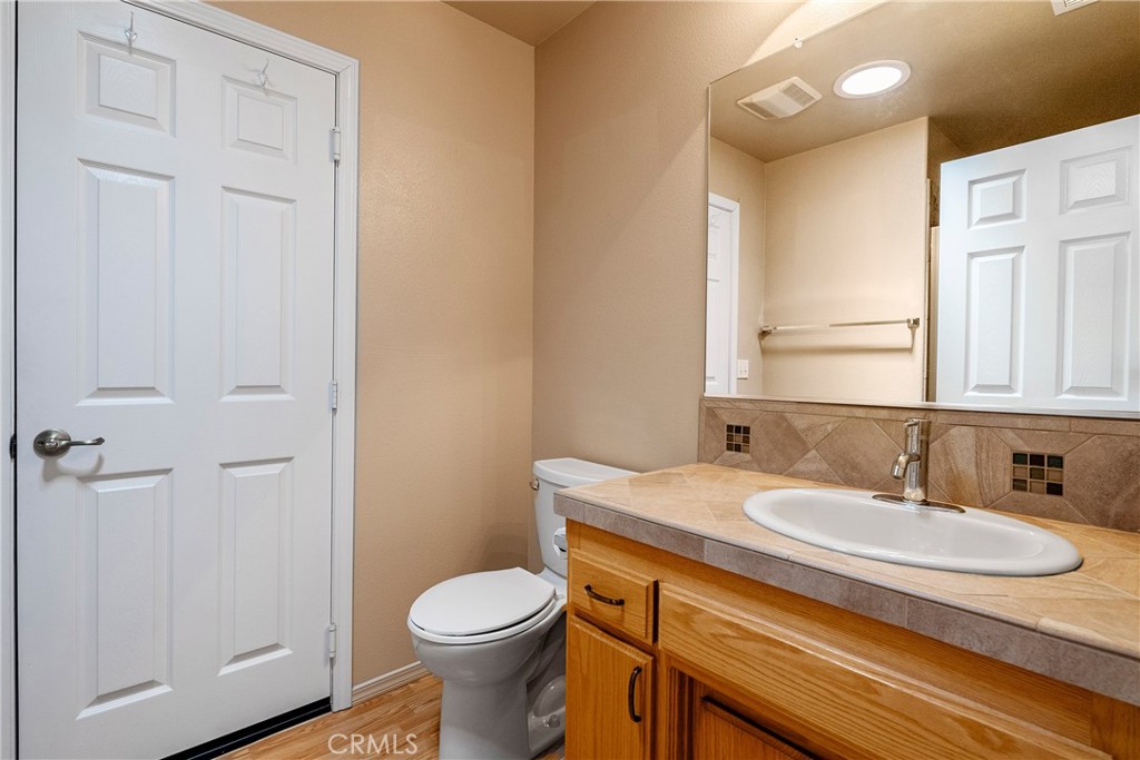 9340 Mountain View Drive Atascadero, CA 93422 - Photo 6 of 50 a bathroom with a sink toilet and vanity