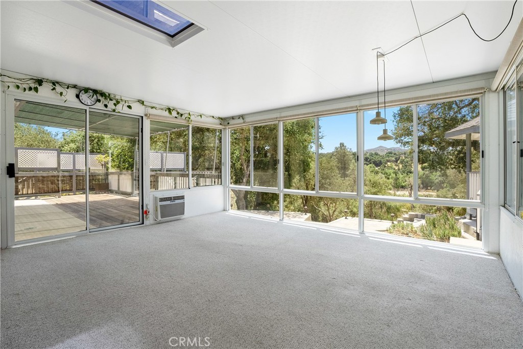 9340 Mountain View Drive Atascadero, CA 93422 - Photo 9 of 50 a view of an empty room with wooden floor and windows