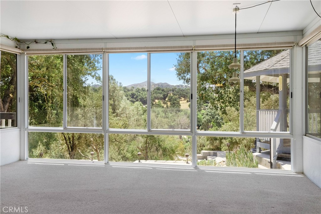 9340 Mountain View Drive Atascadero, CA 93422 - Photo 10 of 50 a view of a room with a large window and outdoor space