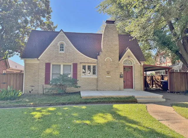 a front view of a house with swimming pool and porch