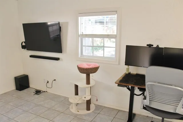 a bathroom with a sink toilet and a window