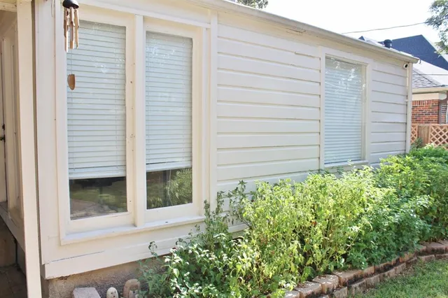 a view of a livingroom with furniture and a window
