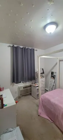 a bedroom with a bed and furniture
