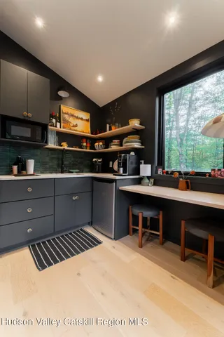 a kitchen with stainless steel appliances kitchen island granite countertop a sink and a stove