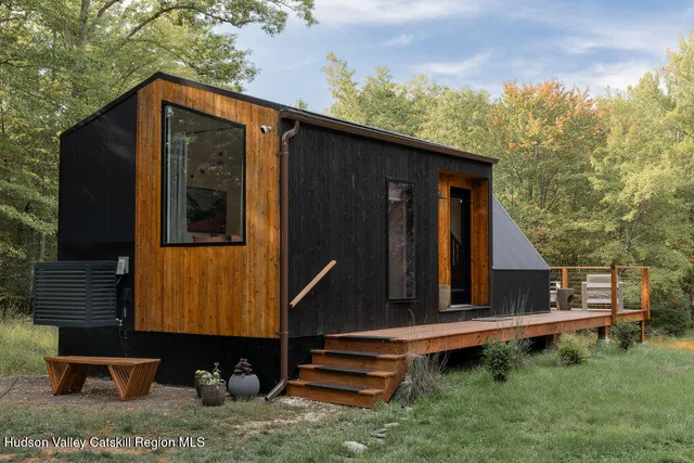 a view of a lake with a house in background