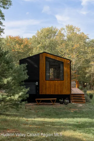 a small house in middle of the forest