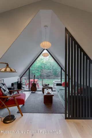 a living room filled with furniture and a chandelier